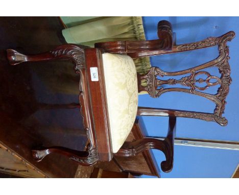 Reproduction mahogany Chippendale style child's chair with drop in upholstered seat on ball and claw feet