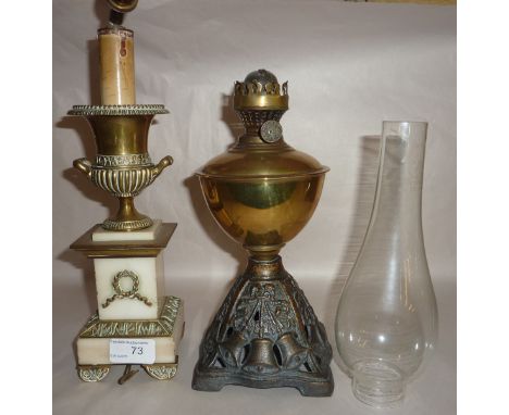 Gilt and onyx garniture crested with urn later converted to electric light fitting and an oil lamp