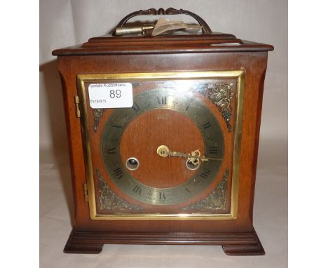 Smith's Enfield cased mantle clock with brass dial