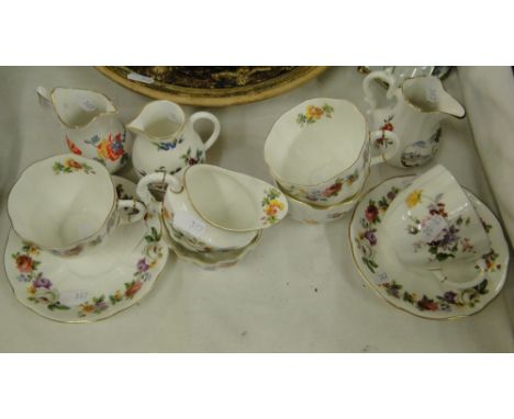 Royal Crown Derby teaware and 3 Royal Worcester jugs.