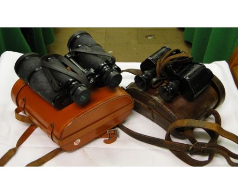 A pair of leather cased First World War army pattern binoculars, 8 x 30 and a pair of green Kat binoculars in case. 