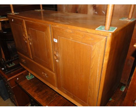 An Ercol elm sideboard 