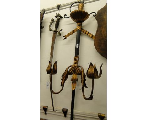 A replica sword and a sword design wall light.