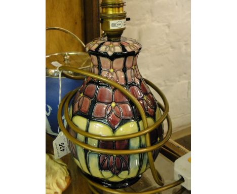 A Moorcroft table lamp,  with panels decorated with tube-lined violets.