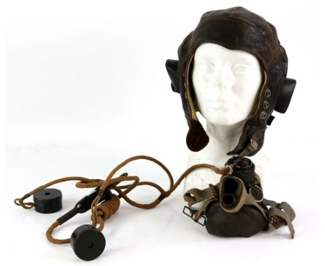  A Royal Air Force chamois-leather lined flying helmet complete with earphones, stores ref. 10A/8543 with R/T cable and cockp