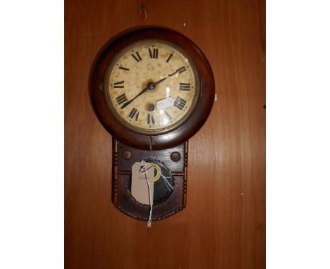 An early 19th C oak drop-dial wall clock the enamel dial with Roman numerals and marked with crossed arrows