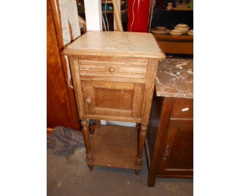 An early 20th C French pine pot cupboard with marble top over a single drawer and enamel lined cupboard, raised on baluster t
