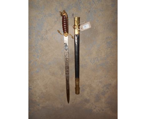 A reproduction Naval side sword with leather and copper bound handle, lions head pommel and scabbard