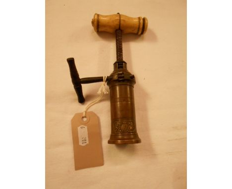 A 19th C Thomason mechanical corkscrew with turned bone handle and applied coat of arms