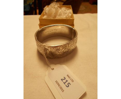 A silver bangle with inscription to back 