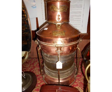 A large copper and brass ships lamp inscribed 'Meteorite 47169' with clear glass shade 