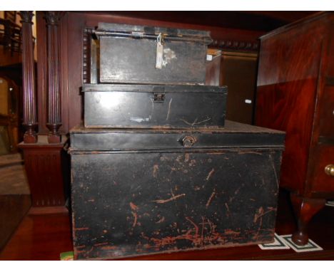 A vintage tin storage trunk and two tin deed boxes