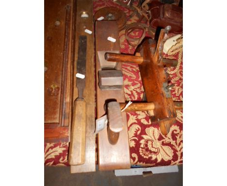 A selection of vintage tools to include block plane, a PB Neiseh moulding plane, leather bound surveyors tape by Treble of En