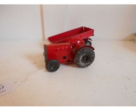 A vintage Minic tin-plate clock work tractor and a tri-ang trailer