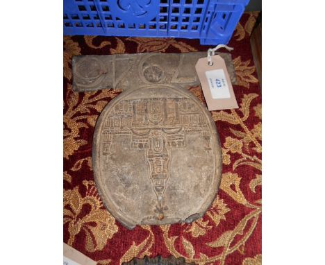 A 19th C lead insurance plaque depicting an architectural spired building with numbers 77946 below