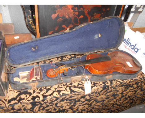 An early 20thC reproduction 'Antonius Stradivarius' violin in original case with label to interior, in need of restoration