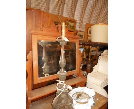 A wood and copper bound lamp with glass ceiling light