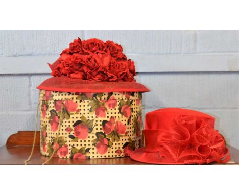 A vintage red hat box decorated with red roses containing a red silk and straw hat by Emma B for Hats Together, together with