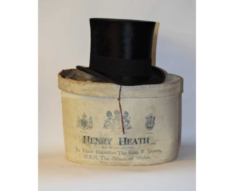 A black silk top hat by Henry Heath Ltd., London, in original cardboard boxInner circumference 54cm approx.External height of