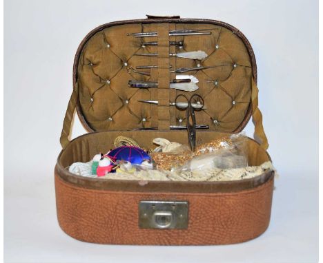 A leather sewing box and mother of pearl handle sewing tools, also included a pair of Harrison Brothers &amp; Howson buttonho