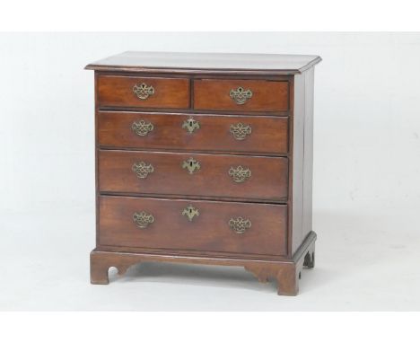 Elm chest of drawers, 18th Century, fitted with two short and three long graduating drawers with later brass fretwork handles