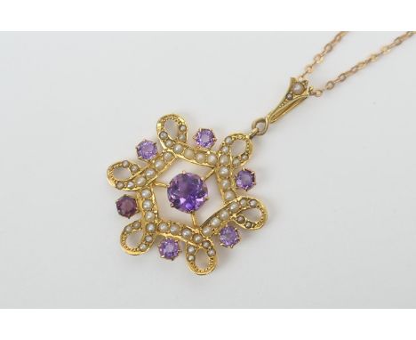 George V amethyst and pearl openwork pendant necklace in 9ct gold, the pendant centred with a round cut amethyst bordered wit