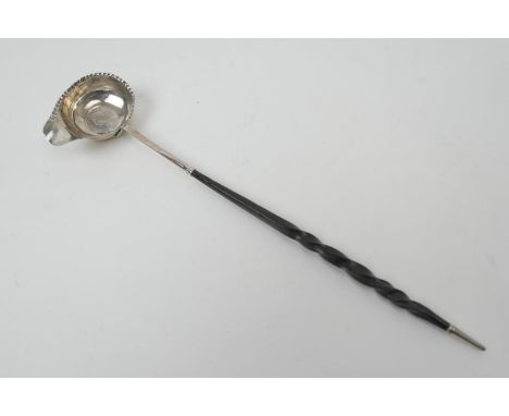 Georgian silver brandy ladle, the bowl with crimped edge centred with a George II coin of 1743, on a twisted Baleen handle, 3