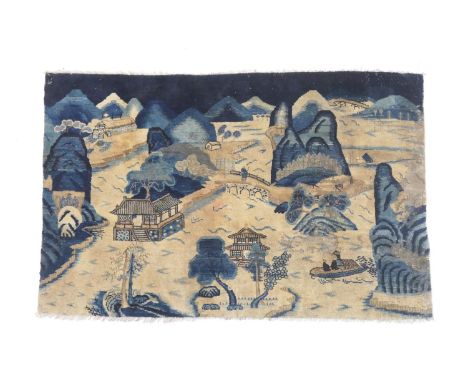 Chinese woollen carpet fragment, 19th Century, worked with a figure crossing a bridge in a mountainous river landscape, 115cm
