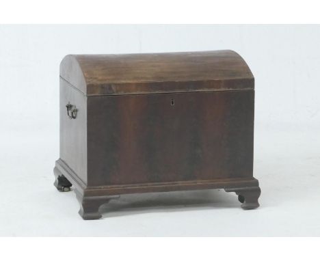 Mahogany cellarette, 19th Century, domed top with twin brass carrying handles, opening to reveal a sectioned interior, raised