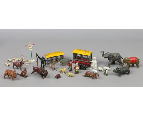 A box of vintage mostly lead toy figures including Charbens examples. Comprising; circus animal cage, clowns, ring master, zo