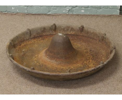 A cast iron cattle feeding trough.