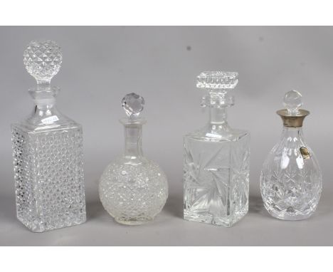 A cut glass silver collar decanter assayed Sheffield 1996, along with three other cut glass examples.