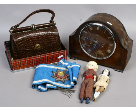 A ladies vintage handbag, a ceremonial sash two dolls and an oak cased eight day mantel clock.