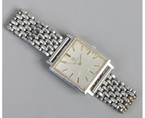 A Gentleman's Omega vintage stainless steel manual bracelet watch with square dial and gilt baton markers.