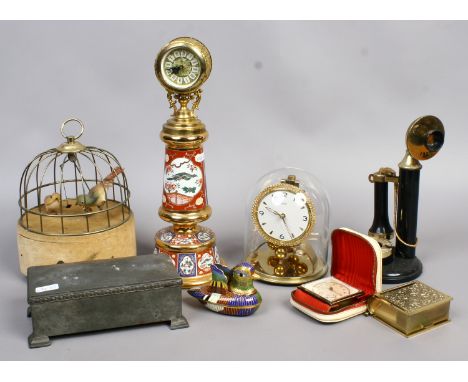 A quantity of collectables Kundo anniversary clock, bird cage automation, novelty stick phone, ashtray and lighter, pewter ci