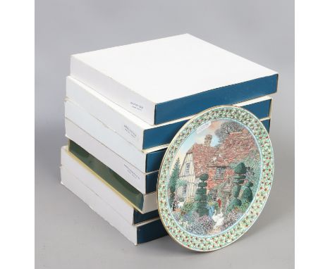 Seven boxed Royal Worcester cabinet plates decorated with cottage scenes.