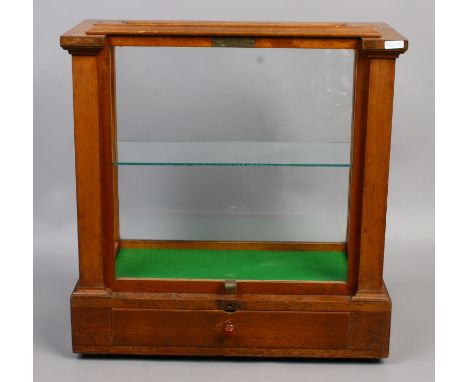 A mahogany display cabinet converted from an 'oertling' chemical balance cabinet with glass shelf.