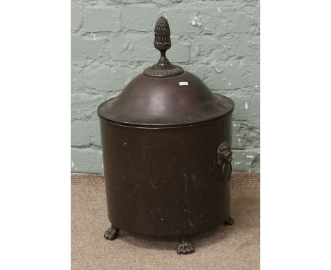 An Adams style bronzed metal coal bucket and cover with pineapple finial and twin mask handles.