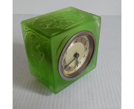 An Art Deco Bohemian lime-green glass-framed boudoir clock with carved decoration, 7.5 x 7.5 x 5 cm, in working order, withou