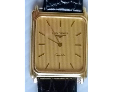 A vintage Longines gents champagne square dial 18K yellow gold dress quartz watch with leather strap and conforming buckle, H