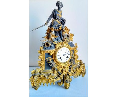 A French 19th century gilt and slate mantle clock with elaborately carved applied figure of knight with sword, by Henry Phill