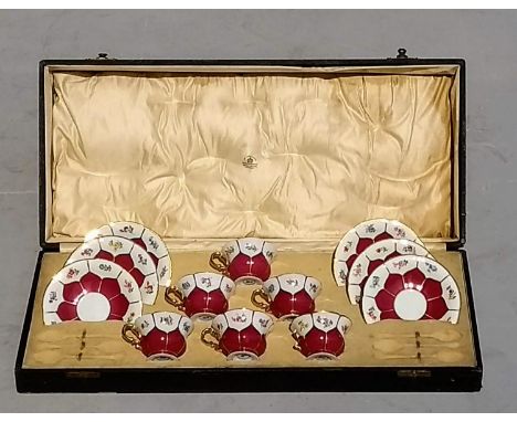 A cased Mappin & Webb coffee set comprising six cups / saucers (handle detached from one cup) with crossed swords stamp to ba