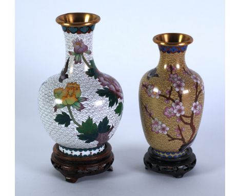 TWO MODERN ORIENTAL CLOISONNE VASES,  on pierced wood stands, both decorated with birds in flight and flowering foliage, set 