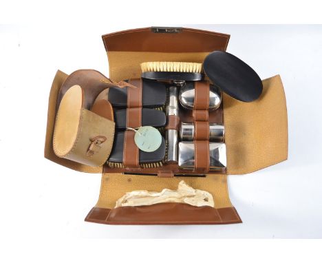 Vintage gentlemans leather cased toiletry travel set and a leather cased brush and comb set