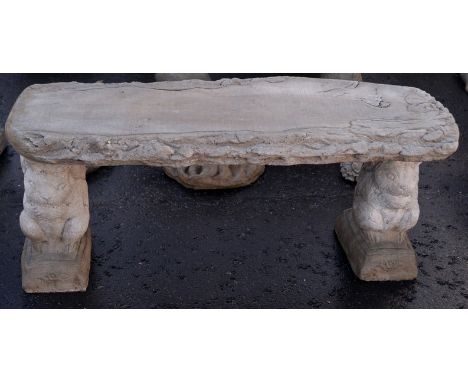 Garden bench with log style top and squirrel supports