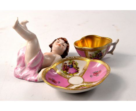 MEISSEN 'Crossed-sword' miniature cup and saucers D: 8cm circa 1900 and a KARL KLETTE, DRESDEN ceramic small girl H: 9cm