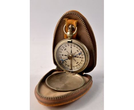 A TAYLOR white metal encased pocket-sized compass with small leather zipped case