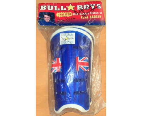 Football. Alan Hansen signed 'Bull Boys' Shinpads. Signed on the packaging label. Unopened, unused. Superb item.  Good condit
