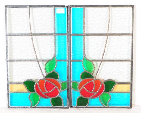 Two vintage 20th century stain glass panels. With leaded panels, floral rose design to corner with colour stained glass. Meas