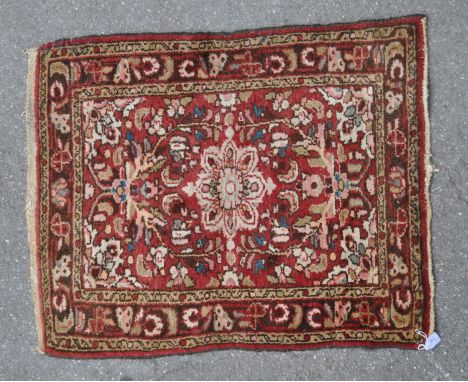 A vintage 20th century Persian Islamic carpet floor rug. Rectangular form with central floral medallion encapsulated in centr